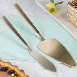 Kakspade och kniv i guldfärgat stål, 2 st.