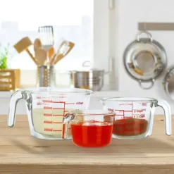 Mått & Måttskedar-Måttkannset, 7x10x13.5 cm, Transparent, Röd