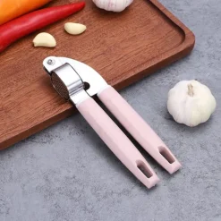 Vitlökspressar-Vitlökspress Rostfritt stål Plasthandtag Vitlöksfärs Lätt att pressa rengöring Vitlökskross för kök Rosa